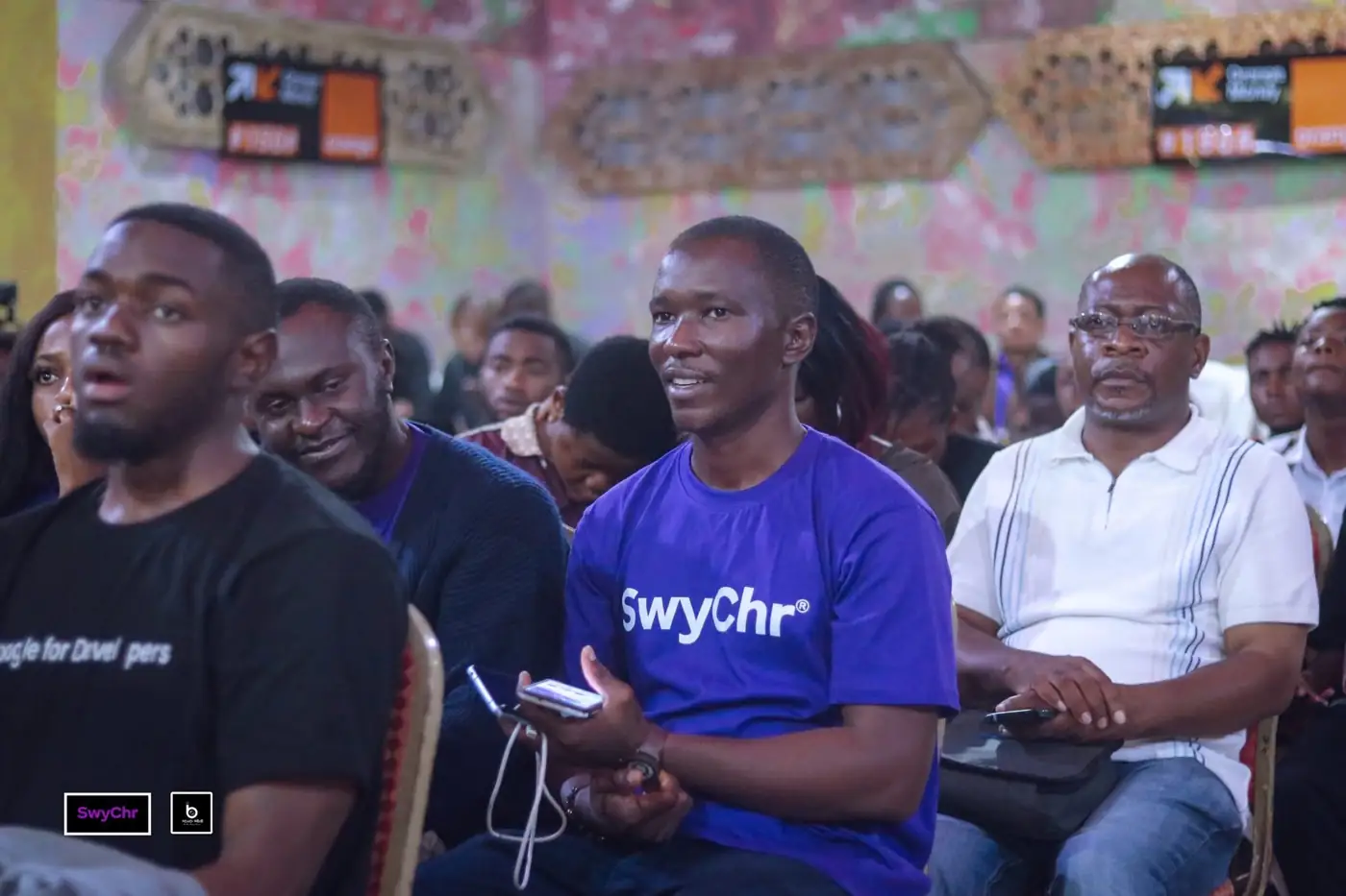 The audience reacting during a session at a past SMCon